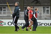 31 January 2016; Eoin Cadogan, Cork, makes his way off the pitch with Dr. Con Murphy, left, and Dr. Aidan Kelleher as Mayo team doctor Sean Moffatt makes his way onto the pitch. Allianz Football League, Division 1, Round 1, Cork v Mayo. Páirc Ui Rinn, Cork. Picture credit: Diarmuid Greene / SPORTSFILE