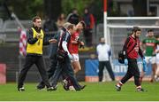 31 January 2016; Eoin Cadogan, Cork, makes his way off the pitch with Dr. Con Murphy and Dr. Aidan Kelleher as Mayo selector Tony McEntee signals towards his team bench. Allianz Football League, Division 1, Round 1, Cork v Mayo. Páirc Ui Rinn, Cork. Picture credit: Diarmuid Greene / SPORTSFILE