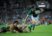 15 November 2009; Tommy Bowe, Ireland, goes past Digby Ioane, left, and Quade Cooper, Australia. Autumn International Guinness Series 2009, Ireland v Australia, Croke Park, Dublin. Picture credit: Brian Lawless / SPORTSFILE