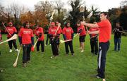 18 November 2009; Fijian-born Cork hurling star, Seán Óg Ó hAilpín, demonatrates how to hold a hurley to the players on a visit to the Fijian Rugby team at its camp in Dublin. The rugby players were treated to a hurling skills session with one of the biggest names in Gaelic games, courtesy of Digicel who are sponsoring the Fijians’ trip to Ireland. Speaking after today’s coaching session, Ó hAilpín said: “Today was a great opportunity for me to show visitors to Ireland what Gaelic games are all about. I was born in Fiji and lived there until I was three, so I’m delighted that Digicel was able to organize this coaching session.” The Fijians play Ireland in the RDS on Saturday, November 21st, in the RDS. Kick off is at 17.15. A limited number of tickets are still available from the Spar shop in Donnybrook. Radisson Blu St Helens Hotel, Stillorgan Road, Dublin. Picture credit: Brendan Moran / SPORTSFILE