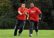 18 November 2009; Fijian-born Cork hurling star, Seán Óg Ó hAilpín, dispossesses Fijian team captain Seremaia Bai on a visit to the Fijian Rugby team at its camp in Dublin. The rugby players were treated to a hurling skills session with one of the biggest names in Gaelic games, courtesy of Digicel who are sponsoring the Fijians’ trip to Ireland. Speaking after today’s coaching session, Ó hAilpín said: “Today was a great opportunity for me to show visitors to Ireland what Gaelic games are all about. I was born in Fiji and lived there until I was three, so I’m delighted that Digicel was able to organize this coaching session.” The Fijians play Ireland in the RDS on Saturday, November 21st, in the RDS. Kick off is at 17.15. A limited number of tickets are still available from the Spar shop in Donnybrook. Radisson Blu St Helens Hotel, Stillorgan Road, Dublin. Picture credit: Brendan Moran / SPORTSFILE