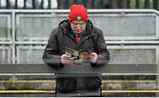 31 January 2016; A Cork supporter studies the match day programme before the game. Allianz Football League, Division 1, Round 1, Cork v Mayo, Páirc Ui Rinn, Cork. Picture credit: Eoin Noonan/SPORTSFILE
