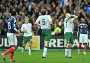 18 November 2009; Dejected Republic of Ireland players Kevin Doyle, Richard Dunne and Robbie Keane at the final whistle. FIFA 2010 World Cup Qualifying Play-off 2nd Leg, Republic of Ireland v France, Stade de France, Saint-Denis, Paris. Picture credit: David Maher / SPORTSFILE