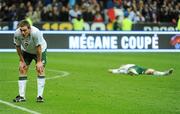 18 November 2009; Dejected Republic of Ireland players Richard Dunne, left, and Robbie Keane after the final whistle. FIFA 2010 World Cup Qualifying Play-off 2nd Leg, Republic of Ireland v France, Stade de France, Saint-Denis, Paris, France. Picture credit: Stephen McCarthy / SPORTSFILE