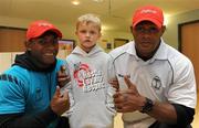 19 November 2009; Fijian team sponsor Digicel arranged for members of the team to pay a special visit to children in Our Lady’s Children’s Hospital, Crumlin, as part of their trip to Ireland. The Fijians play Ireland in the RDS on Saturday, November 21st, in the RDS. Kick off is at 17.15. A limited number of tickets are still available from the Spar shop in Donnybrook. Pictured are Mickey Connors, age 6, from Dublin, with Fijian rugby players Waisale Vatuvoka, left, and Vereniki Sauturaga during a team visit to Our Lady's Children's Hospital, Crumlin, Dublin. Picture credit: Matt Browne / SPORTSFILE    *** Local Caption ***