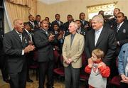 20 November 2009; The Fijian rugby team welcomed Mr Denis O’Brien, Founder of Digicel, the Fijian rugby team sponsor, to the official team blessing. The Fijian ritual, which took place at the Radisson Hotel, Stillorgan, involves the blessing of the team jerseys before each game. The team then presented Mr O’Brien with a signed jersey ahead of their clash with Ireland. Pictured are, Mr Denis O’Brien, Founder of Digicel, with his son Patrick, age 5, Henry Jack, son of Dr. Harry Jack, Former President of Kadavu RFC in Fiji, with Fiji players and officials. Radisson Blu St Helens Hotel, Stillorgan Road, Dublin. Picture credit: Brian Lawless / SPORTSFILE