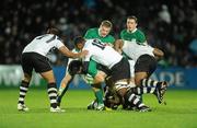 21 November 2009; Shane Horgan, Ireland, supported by team mates, Jamie Heaslip and Eoin Reddan, right, is tackled by Fiji players from left, Akapusi Qera, Leone Nakarawa and Viliame Veikoso. Autumn International Guinness Series 2009, Ireland v Fiji, Royal Dublin Society, Ballsbridge, Dublin. Picture credit: Stephen McCarthy / SPORTSFILE