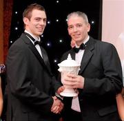 20 November 2009 : Neil McManus, from Antrim, who won the Hurler of the year Award, left, receives his award from John Martin, at the Ulster GAA writers Annual Awards Banquet 2009. The 22nd Ulster GAA Writers Association  Award Banquet, sponsored by Quinn Insurance, Slieve Russell Hotel, Ballyconnell, Co. Cavan. Picture credit: Oliver McVeigh / SPORTSFILE