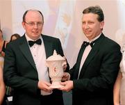 20 November 2009 : Damien Harvey, left, Tyrone County PRO, accepts the Footballer of the Year award on behalf of Kevin Hughes, from John Maguire, MD, Belleek Pottery, at the Ulster GAA writers Annual Awards Banquet 2009. The 22nd Ulster GAA Writers Association  Award Banquet, sponsored by Quinn Insurance, Slieve Russell Hotel, Ballyconnell, Co. Cavan. Picture credit: Oliver McVeigh / SPORTSFILE