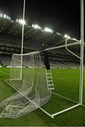 30 January 2016; Colm Daly, a member of the Croke Park ground staff, removes the nets after the game. Allianz Football League, Division 1, Round 1, Dublin v Kerry, Croke Park, Dublin. Picture credit: Ray McManus / SPORTSFILE