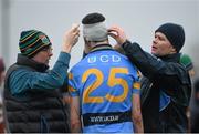 4 February 2016; Tom Phelan, University College Dublin, receives medical attention from Dr James Foley, left, and physio Diarmuid Fitzgerald, after picking up a head injury. Independent.ie HE GAA Fitzgibbon Cup Group A, Round 2, Limerick Institute Technology v University College Dublin. LIT, Limerick. Picture credit: Diarmuid Greene / SPORTSFILE