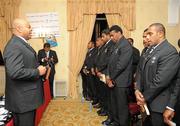20 November 2009; The Fijian rugby team welcomed Mr Denis O’Brien, Founder of Digicel, the Fijian rugby team sponsor, to the official team blessing. The Fijian ritual, which took place at the Radisson Hotel, Stillorgan, involves the blessing of the team jerseys before each game. The team then presented Mr O’Brien with a signed jersey ahead of their clash with Ireland. Pictured is Fijian Head Coach Designate Sam Domoni with the players. Radisson Blu St Helens Hotel, Stillorgan Road, Dublin. Picture credit: Brian Lawless / SPORTSFILE