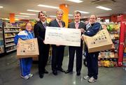 25 November 2009; At a cheque presentation of €50,000 to Special Olympics Ireland from MACE stores and WEEE Ireland are, from left, Special Olympics athlete Paula Carroll, Leo Donovan, WEEE Ireland, Willie O'Byrne, MACE, Matt English, CEO, Special Olympics Ireland and Special Olympics Athlete Claire Adams. The money was raised for Special Olympics Ireland through the sale of a special reusable shopping bag in MACE stores nationwide. MACE, Shantalla, Beaumount, Dublin. Picture credit: Brendan Moran / SPORTSFILE