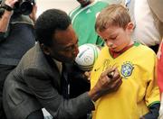 26 November 2009; Adam McGovern, aged 9, from Co. Dublin, gets his shirt signed by Pelé during a visit to Our Lady's Children's Hospital, Crumlin, Dublin. Picture credit: Pat Murphy / SPORTSFILE