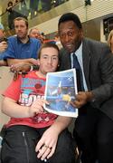 26 November 2009; Brian Shortt, aged 17, from Co. Dublin, with Pelé during a visit to Our Lady's Children's Hospital, Crumlin, Dublin. Picture credit: Pat Murphy / SPORTSFILE