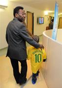 26 November 2009; Adam McGovern, aged 9, from Co. Dublin, with Pelé during a visit to Our Lady's Children's Hospital, Crumlin, Dublin. Picture credit: Pat Murphy / SPORTSFILE