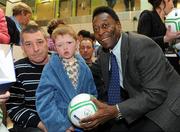 26 November 2009; Christopher O'Brien, age 7, from Bray, Co. Wicklow, and his dad Christy, with Pelé during a visit to Our Lady's Children's Hospital, Crumlin, Dublin. Picture credit: Pat Murphy / SPORTSFILE