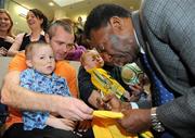 26 November 2009; Conor Durkin, age 5, from Co. Dublin, with his dad Ciaran, gets a shirt signed by Pelé during a visit to Our Lady's Children's Hospital, Crumlin, Dublin. Picture credit: Pat Murphy / SPORTSFILE