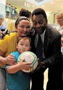 26 November 2009; David Curley, age 3, from Co. Dublin, and his mother Oyuntsatsral Noidansuren with Pelé during a visit to Our Lady's Children's Hospital, Crumlin, Dublin. Picture credit: Pat Murphy / SPORTSFILE