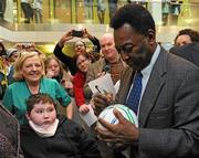 26 November 2009; Stephen Callanan, from Ballydehob, Co. Cork, and Nurse Bernie McNicholas, left, get a football signed by Pelé during a visit to Our Lady's Children's Hospital, Crumlin, Dublin. Picture credit: Pat Murphy / SPORTSFILE