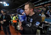6 February 2016; St Mary's goalkeeper Austin Constable celebrates with his son Archie following his side's victory. AIB GAA Football All-Ireland Intermediate Club Championship Final, Hollymount-Carramore, Mayo, v St Mary's, Kerry. Croke Park, Dublin. Picture credit: Stephen McCarthy / SPORTSFILE