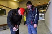 7 February 2016; Tyrone manager Mickey Harte signs an autograph for Ollie Reilly, from Killimor, Co. Galway, before the game against Galway.  Allianz Football League, Division 2, Round 2, Galway v Tyrone. Pearse Stadium, Galway. Picture credit: Matt Browne / SPORTSFILE