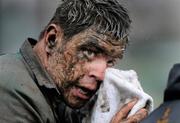 17 January 2009; Brian Cawley, UCD, wipes mud from his eyes during the game. AIB League Division 1, Clontarf v UCD, Castle Avenue, Clontarf, Dublin. Picture credit: Matt Browne / SPORTSFILE