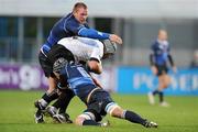 27 November 2009; Laurie McGolone, Cornish Pirates, is tackled by Stephen Keogh and Kevin McLaughlin, no. 6, Leinster. British & Irish Cup, Leinster v Cornish Pirates, Donnybrook Stadium, Donnybrook, Dublin. Photo by Sportsfile