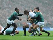 28 November 2009; Donncha O'Callaghan, Ireland, is tackled by South Africa players, from left, John Smit, Fourie du Preez and Marne Steyn. Autumn International Guinness Series 2009, Ireland v South Africa, Croke Park, Dublin. Picture credit: Stephen McCarthy / SPORTSFILE