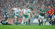 28 November 2009; Brian O'Driscoll, Ireland, supported by team-mate Cian Healy, breaks through the South African defence. Autumn International Guinness Series 2009, Ireland v South Africa, Croke Park, Dublin. Picture credit: Brendan Moran / SPORTSFILE