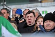 29 November 2009; An Taoiseach Brian Cowen T.D., watches on during the presentation to Ballyhale Shamrocks captain Eamonn Walsh at the end of the game. AIB GAA Hurling Leinster Club Senior Championship Final, Tullamore v Ballyhale Shamrocks, O'Connor Park, Tullamore. Picture credit: David Maher / SPORTSFILE *** Local Caption ***