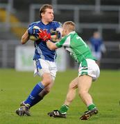 29 November 2009; Kevin McGourty, St. Gall's, in action against Fiontann Devlin, Loup. AIB GAA Football Ulster Club Senior Championship Final, St. Gall's v Loup, Páirc Esler, Newry, Co. Down. Picture credit: Oliver McVeigh / SPORTSFILE