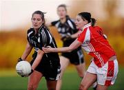 29 November 2009; Regina Curtin, Donoughmore, in action against Majella Woods, Donamoyne. Tesco All-Ireland Ladies Senior Club Championship Final, Donoughmore, Cork v Donamoyne, Monaghan, St. Rynagh's GAA Club, Banagher, Co. Offaly. Picture credit: Stephen McCarthy / SPORTSFILE