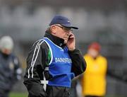 29 November 2009; Loup Manager, John Brennan, on the phone during the half time break. AIB GAA Football Ulster Club Senior Championship Final, St. Gall's v Loup, Páirc Esler, Newry, Co. Down. Picture credit: Oliver McVeigh / SPORTSFILE