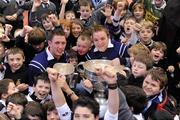 30 November 2009; All-Ireland winning captains and Ulster Bank employees Michael Fennelly, Kilkenny, and Darran O’Sullivan, Kerry, are pictured with delighted school children from Terenure College. The Ulster Bank pair are visiting schools to celebrate their fantastic achievement and promote GAA with primary and secondary school children. Terenure College, Terenure, Dublin. Picture credit: Pat Murphy / SPORTSFILE