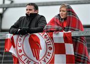 7 February 2016; Tyrone supporters Caitlin Campbell and Adrian Nugent from Killeeshil, Co. Tyrone, watch the match. Allianz Football League, Division 2, Round 2, Galway v Tyrone. Pearse Stadium, Galway. Picture credit: Matt Browne / SPORTSFILE