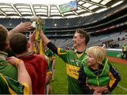 7 February 2016; Richard Mullally, Glenmore, hands the cup over to his team-mates with his son Richie Jr., age 3. AIB GAA Hurling All-Ireland Junior Club Championship Final, Eoghan Rua v Glenmore. Croke Park, Dublin. Picture credit: Cody Glenn / SPORTSFILE