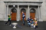 1 December 2009; All-Ireland winning captains and Ulster Bank employees Michael Fennelly, Kilkenny, and Darran O’Sullivan, Kerry, left, with Scoil San Treasa pupils Jake Daly, age 11, from 6th class, right, and Kim Healy, age 11, from 5th class, during a visit to their school. The Ulster Bank pair are visiting schools to celebrate their fantastic achievement and promote GAA with primary and secondary school children. Scoil San Treasa, Mount Merrion, Co. Dublin. Picture credit: Stephen McCarthy / SPORTSFILE