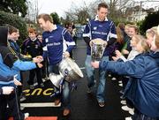 1 December 2009; All-Ireland winning captains and Ulster Bank employees Darran O’Sullivan, Kerry, and Michael Fennelly, Kilkenny, are greeted by delighted school children from Scoil San Treasa. The Ulster Bank pair are visiting schools to celebrate their fantastic achievement and promote GAA with primary and secondary school children. Scoil San Treasa, Mount Merrion, Co. Dublin. Picture credit: Stephen McCarthy / SPORTSFILE