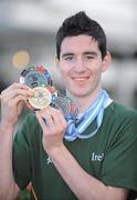 2 December 2009; Dylan Fitzgibbon, age 15, from Cork City, and a member of the Ireland Taekwon-Do team, with the medals he won at the Taekwon-Do World Championships in Argentina, on the Irish team's arrival in Dublin Airport. The 36 strong team won a total of 11 medals, 2 Gold, 3 Silver and 6 Bronze. Dublin Airport, Dublin. Picture credit: Brendan Moran / SPORTSFILE