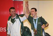 2 December 2009; Medal winning member of the Ireland Taekwon-Do team Luke Woods, from Dublin, is celebrated by team coach Stephen Cooley on the team's arrival in Dublin Airport from the Taekwon-Do World Championships in Argentina.The 36 strong team won a total of 11 medals, 2 Gold, 3 Silver and 6 Bronze. Dublin Airport, Dublin. Picture credit: Brendan Moran / SPORTSFILE