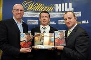 3 December 2009; Cork hurler Donal Og Cusack, centre, with Michael McLoughlin, left, Managing Director Penguin Books, and David Hood, Public Relations Director with Williamhill.com, after Cusack's autobiography &quot;Come What May&quot; was announced as the winner of the 2009 Williamhill.com Irish Sports Book of the Year. William Hill Bookmakers, Dame Street, Dublin. Picture credit: Matt Browne / SPORTSFILE