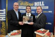 3 December 2009; Cork hurler Donal Og Cusack, centre, with Michael McLoughlin, left, Managing Director Penguin Books, and David Hood, Public Relations Director with Williamhill.com, after Cusack's autobiography &quot;Come What May&quot; was announced as the winner of the 2009 Williamhill.com Irish Sports Book of the Year. William Hill Bookmakers, Dame Street, Dublin. Picture credit: Matt Browne / SPORTSFILE