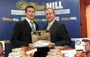 3 December 2009; Cork hurler Donal Og Cusack, left, receives his award from David Hood, Public Relations Director with Williamhill.com, after Cusack's autobiography &quot;Come What May&quot; was announced as the winner of the 2009 Williamhill.com Irish Sports Book of the Year. William Hill Bookmakers, Dame Street, Dublin. Picture credit: Matt Browne / SPORTSFILE