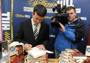 3 December 2009; Cork hurler Donal Og Cusack autographs copies of his book &quot;Come What May&quot; after he was announced as the winner of the 2009 Williamhill.com Irish Sports Book of the Year. William Hill Bookmakers, Dame Street, Dublin. Picture credit: Matt Browne / SPORTSFILE
