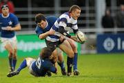 5 December 2009; David Moore, Blackrock College, is tackled by Cormac Quinn, 9, and Colm McMahon, St Mary's College. AIB League Division 1, St Mary's College v Blackrock College, Templeville Road, Dublin. Picture credit: Matt Browne / SPORTSFILE