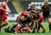 5 December 2009; Tomas O'Leary, Munster, gets caught in possession by Jonathan Thomas, Ospreys. Celtic League, Ospreys v Munster, Liberty Stadium, Swansea, Wales. Picture credit: Steve Pope / SPORTSFILE