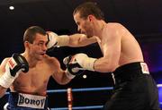 5 December 2009; Damian Taggart lands a right on Wladimir Borov during their International Lightweight bout. Sierra Fight Night Undercard. National Stadium, Dublin. Picture credit: Stephen McCarthy / SPORTSFILE