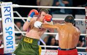 5 December 2009; Matthew Macklin, left, exchanges punches with Rafa Sosa Pintos. Sierra Fight Night, Matthew Macklin v Rafa Sosa Pintos. National Stadium, Dublin. Picture credit: Barry Cregg / SPORTSFILE