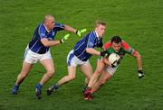 6 December 2009; Peter O'Dwyer, Kilmurray Ibrickane, in action against Barry John Walsh and Micheal Quirke, left, Kerins O'Rahilly's. AIB GAA Football Munster Club Senior Championship Final, Kilmurray Ibrickane, Clare, v Kerins O'Rahilly's, Kerry. Gaelic Grounds, Limerick. Picture credit: Stephen McCarthy / SPORTSFILE